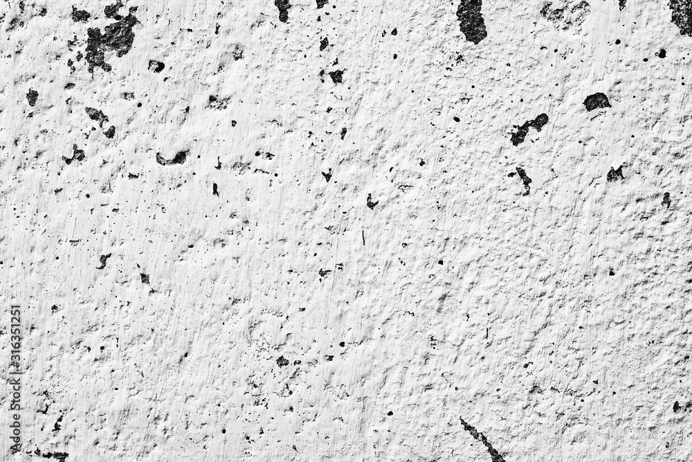 Texture of a concrete wall with cracks and scratches which can be used as a background Texture of a concrete wall with cracks and scratches which can be used as a background