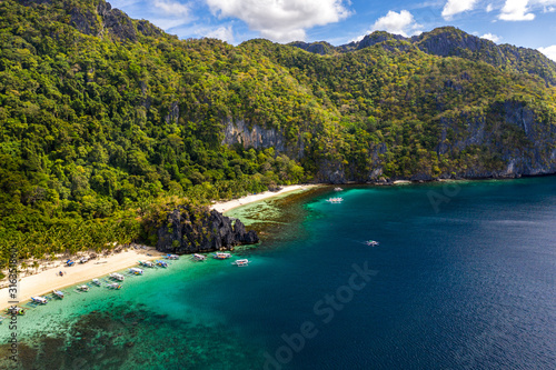 Top view of beautiful turquoise beach, with white sand. Best beaches of Philippines. Seven Commandos beach, Palawan © Anatolii