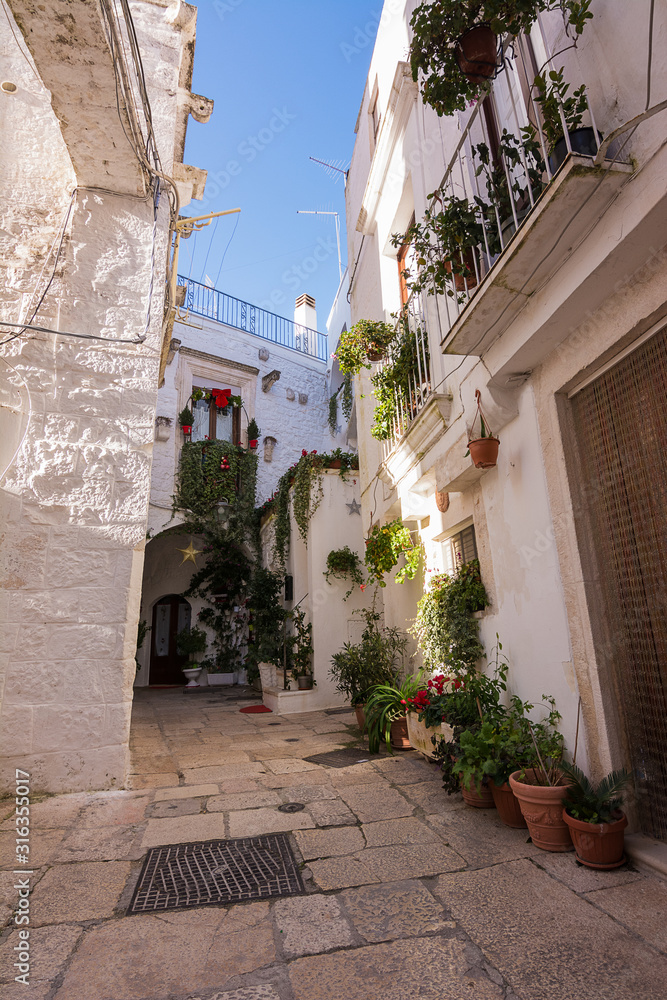 Typical alley in the historic center of Cisternino in Puglia (Italy)