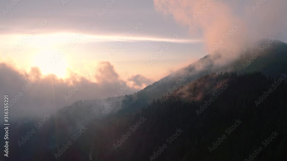 Magic morning sunrise natural flying through the clouds above mountain tops sunshine sunset clouds sky sun sunny environment forest travel view scene peak weather