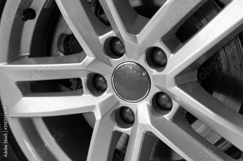 Wheel expensive car. Close-up chrome disc with low-profile rubber, selective and soft focus.