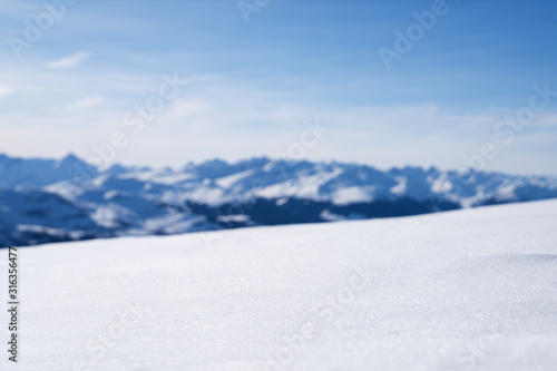 Snowy Landscape With Blurred Mountains At Background