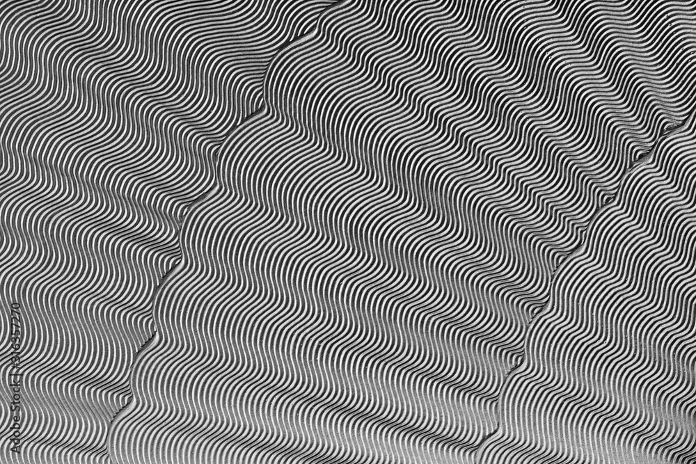 Silver Wavy Fabric For Luxury Background For Text About Fashion And Luxury. Abstract Geometric Gray Background With Curve Line And Wave Pattern. Silver Wavy Fabric For Luxury Background For Text About Fashion And Luxury. Abstract Geometric Gray Background With Curve Line And Wave Pattern.