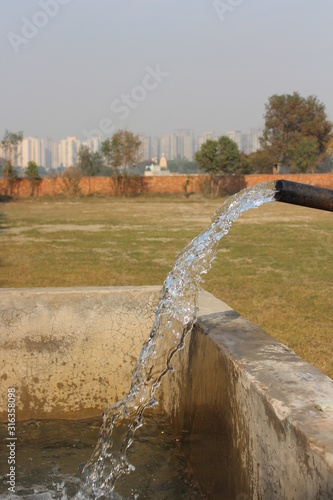 Close up of water flowing from a tube well