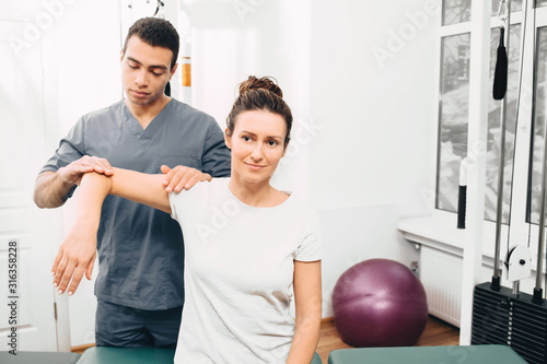 Photography Arthritis of the elbow joint in a woman patient in a rehabilitation center