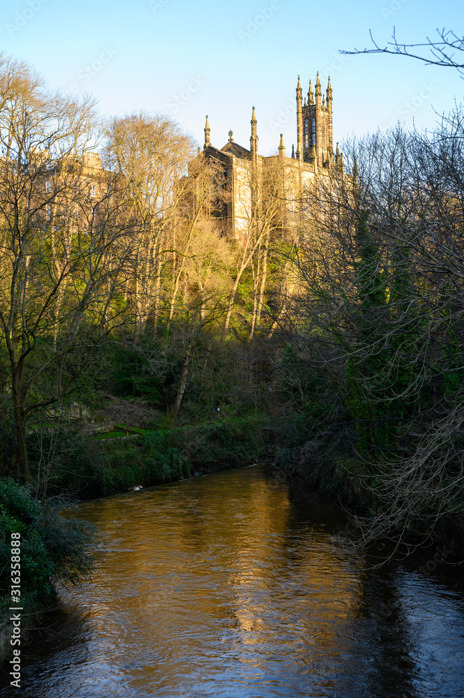 View on old Gothic church near Dean village in New Town part of Edinburgh city, capital of Scotland, in sunny day