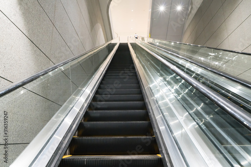 modern escalator in shopping center © onlyyouqj