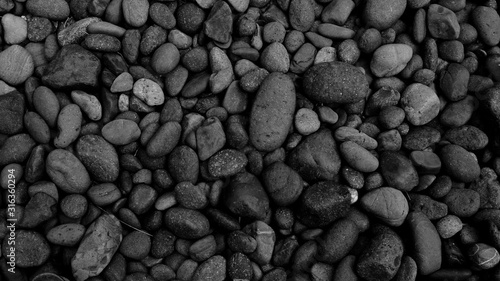 black stone background, pebble beach surface