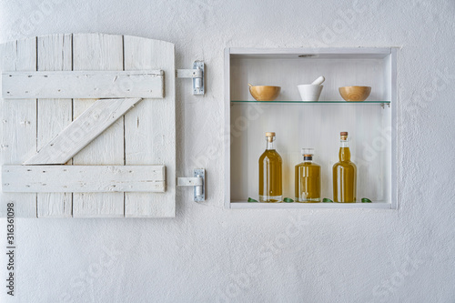 hous home design wall shelf  Olive oil bottle oils three bottles shelf food cooking mediterranean natural organic toscany beauty country house healthy stylish white copy space kitchen barn greece