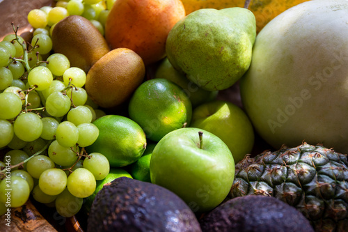 Fototapeta Naklejka Na Ścianę i Meble -  Pineapple, apple, pear, grapes, melon, honeymelon and Avocado