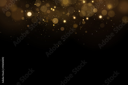 Abstract magical flying lights with golden glares bokeh on a black background. Christmas light effect. Vector illustration © sersupervector