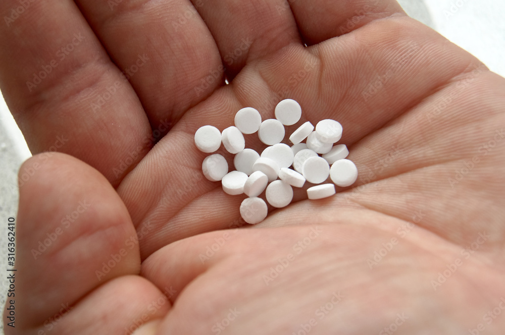 sweetener tablets lying on a light background sweetener tablets lying on a light background