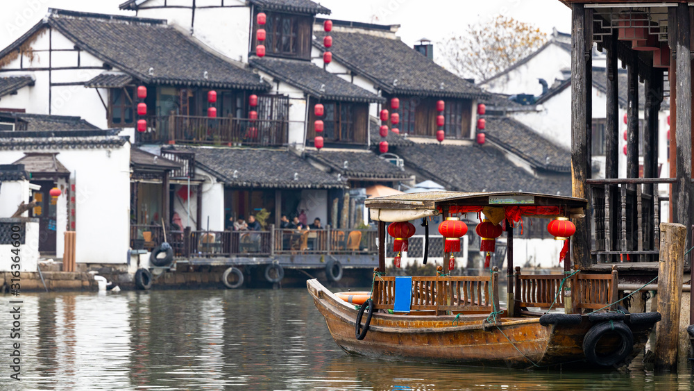 Zhujiajiao Water Town and China traditional tourist boats on canals of Shanghai Zhujiajiao Water Town in Shanghai, China.
