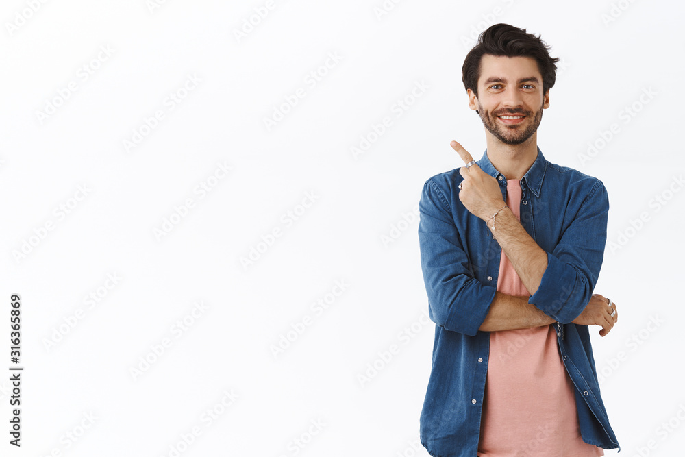 Pleased, confident good-looking bearded man in t-shirt, shirt, pointing upper left corner, smiling satisfied and amused, give advice, proudly showing friend where christmas gifts hidden from family Pleased, confident good-looking bearded man in t-shirt, shirt, pointing upper left corner, smiling satisfied and amused, give advice, proudly showing friend where christmas gifts hidden from family