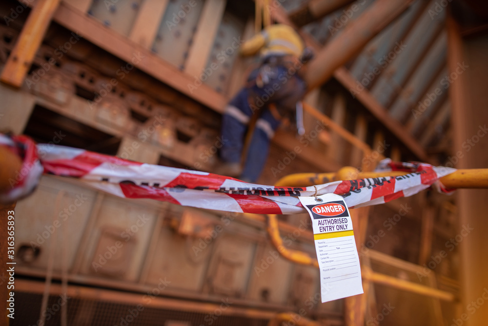 Foto de Safety prevention red and white danger tape and tag are