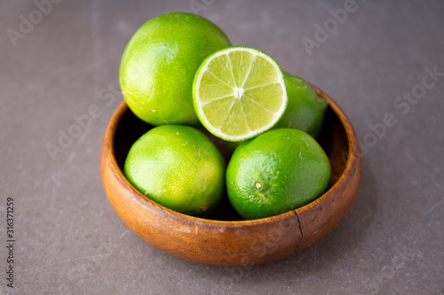 Fresh Limes in the wooden bowl