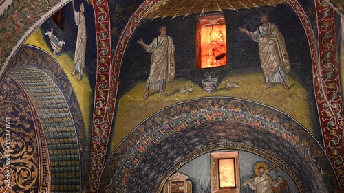 Ravenna, Italy, December 2019. Mausoleum of Galla Placidia, tilt footage on a lunette with the apostles. The drinking doves represent the search for eternal peace at the source of divine salvation. photo