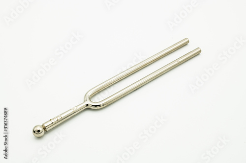 A tuning fork 440 Hz on a white background © Stefan