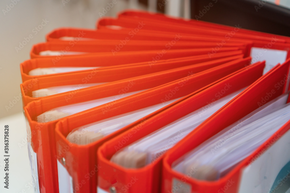 Documents Binder Paper, Red Files folder on office desk, Annual Report document for Business papers financial market in offices, lawyer research achieves. Concept work hard or a lot information Documents Binder Paper, Red Files folder on office desk, Annual Report document for Business papers financial market in offices, lawyer research achieves. Concept work hard or a lot information