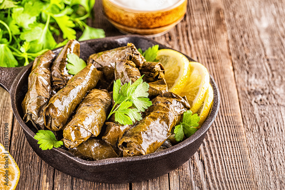 Dolma, stuffed grape leaves with rice and meat. Dolma, stuffed grape leaves with rice and meat.