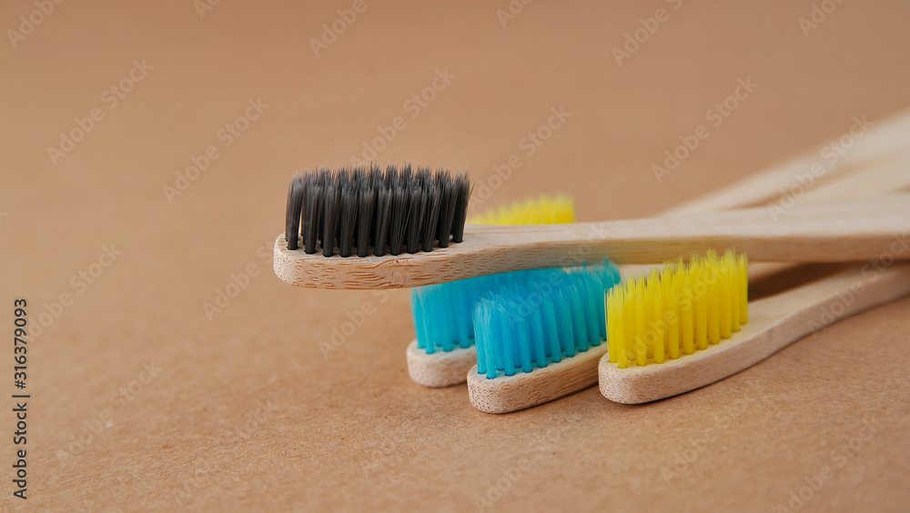 Bamboo toothbrushes on craft paper. Eco concept. Zero waste. Bamboo toothbrushes on craft paper. Eco concept. Zero waste.