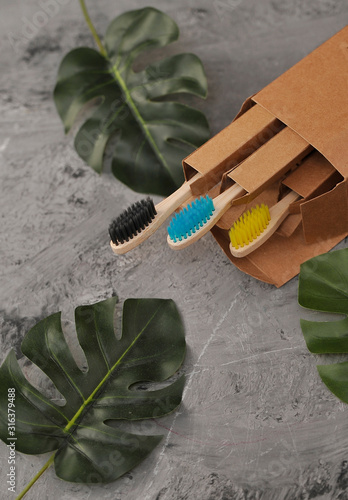 Bamboo toothbrushes on stone background. Eco concept. Zero waste.
