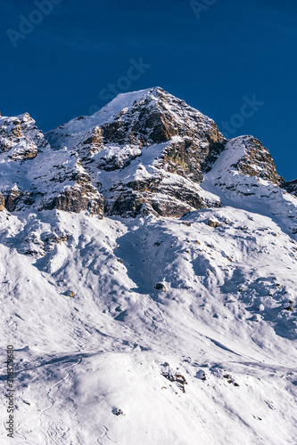 The mountains of the Aosta Valley during a fantastic winter day near the Matterhorn and the town of Breuil-Cervinia, Italy - December 2019.