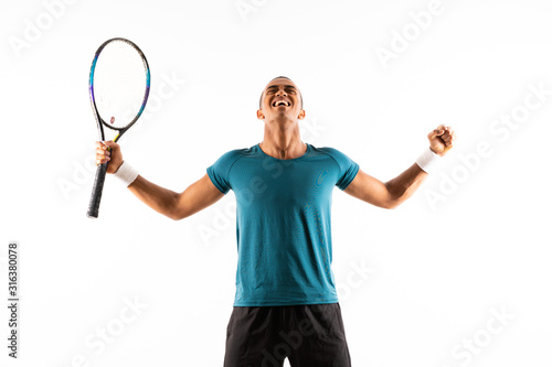 Afro American tennis player man over isolated white background . © luismolinero