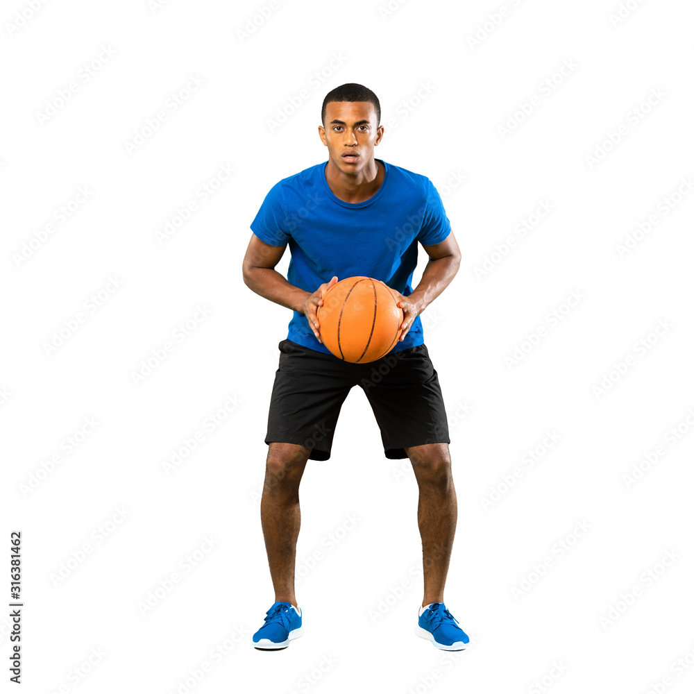 Full-length shot of Afro American basketball player man over isolated white background Full-length shot of Afro American basketball player man over isolated white background