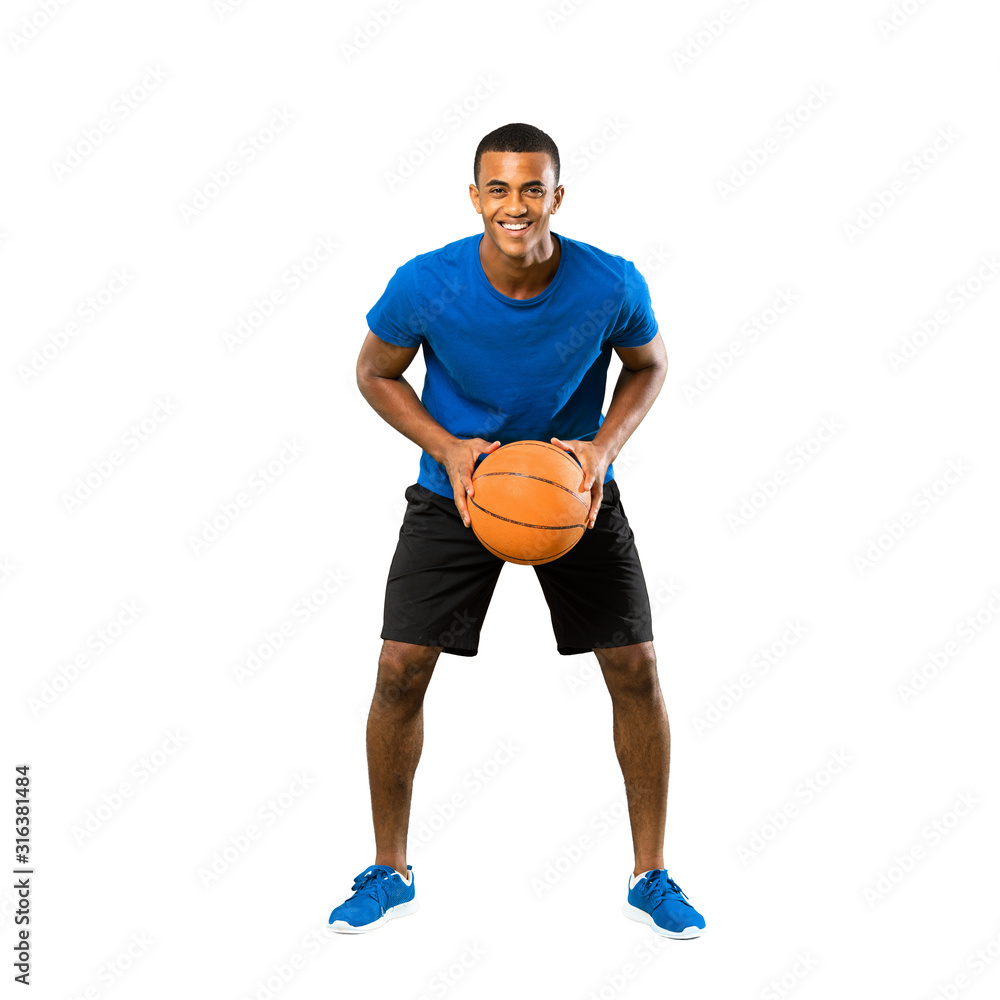 Full-length shot of Afro American basketball player man over isolated white background Full-length shot of Afro American basketball player man over isolated white background