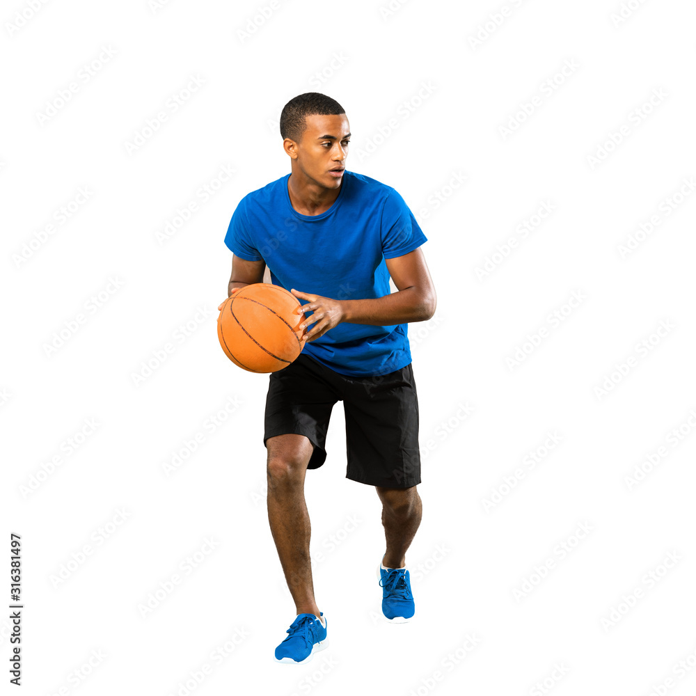Full-length shot of Afro American basketball player man over isolated white background Full-length shot of Afro American basketball player man over isolated white background