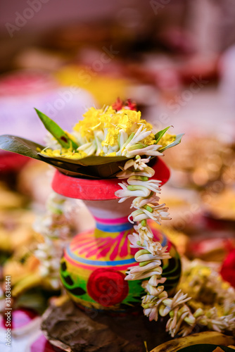 Bengali marriage rituals with beautiful decoration of clay pot for bride and groom in India