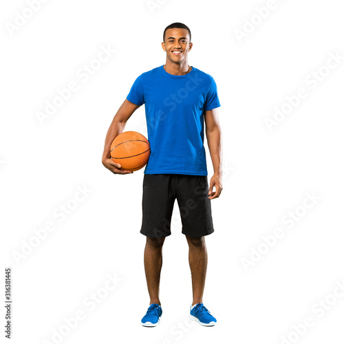 Full-length shot of Afro American basketball player man over isolated white background © luismolinero