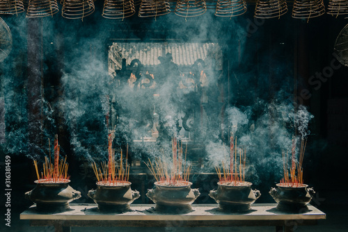 incense burning in a moody temple