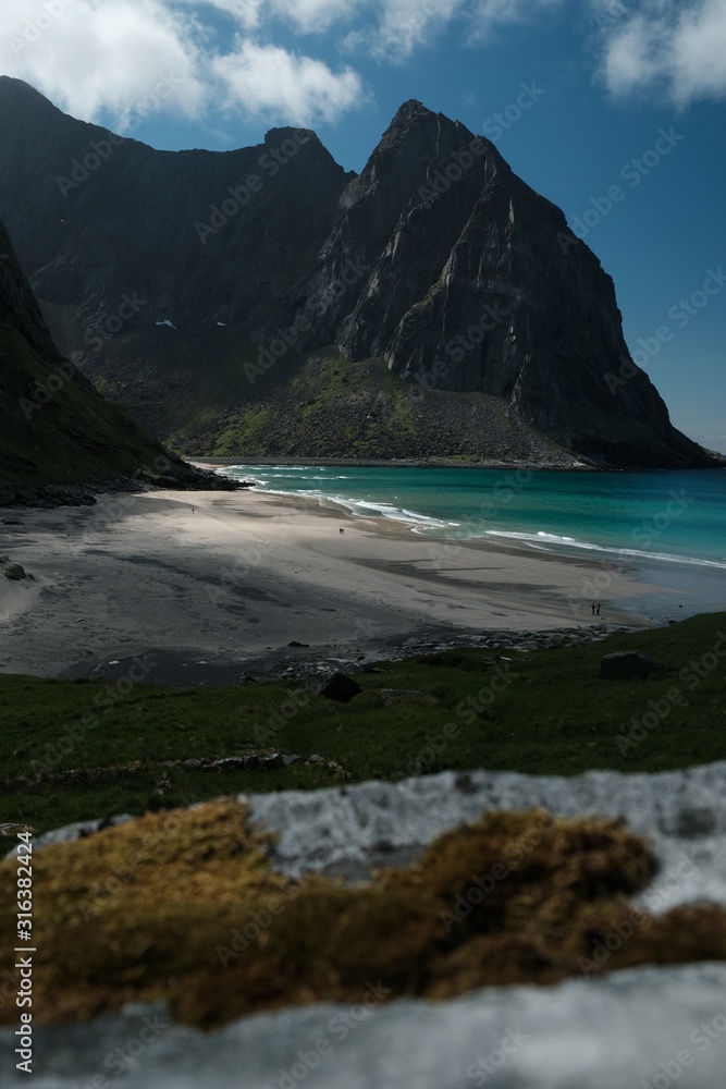 famous kvalvika beach in lofoten islands. view from ryten mountain and turquoise water