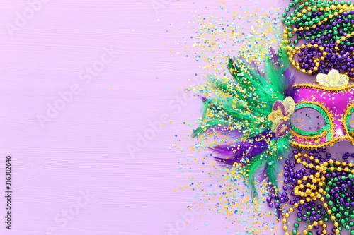 Holidays image of mardi gras masquarade venetian mask over purple background Fototapet