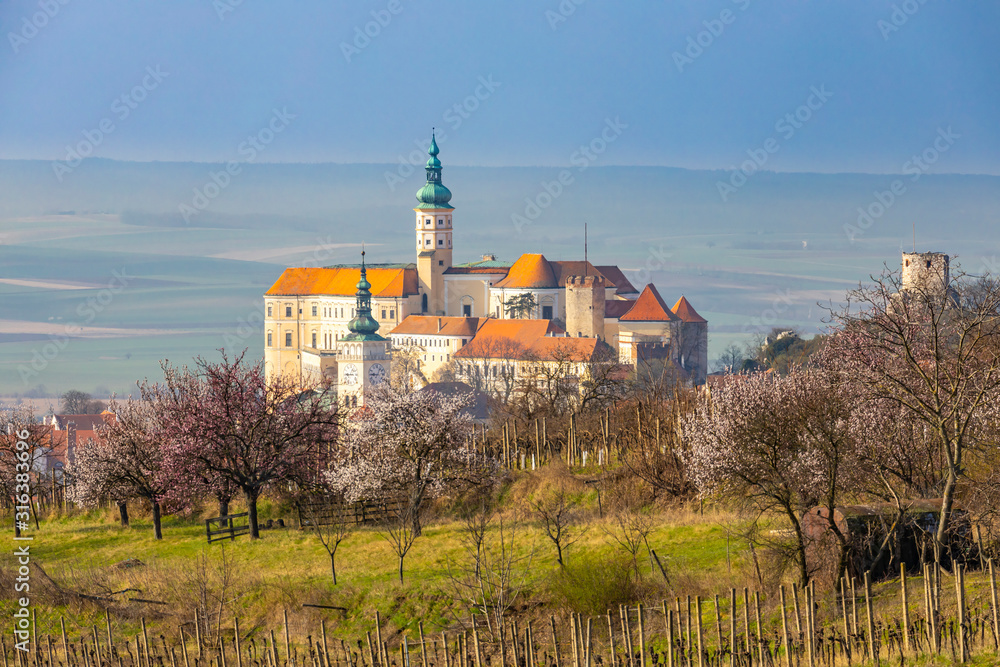 Mikulov castle with blooming trees, South Moravia, Czech Republic