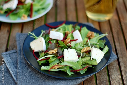 Fresh salad with lettuce, beetroot, walnut and camembert cheese