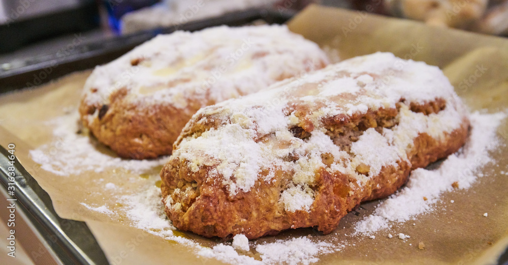 Traditional Christmas Stollen dusted with sugar Traditional Christmas Stollen dusted with sugar