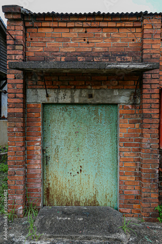 old door in brick wall