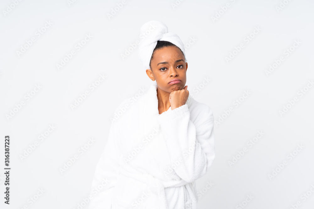 African american woman in a bathrobe over isolated background unhappy and frustrated African american woman in a bathrobe over isolated background unhappy and frustrated