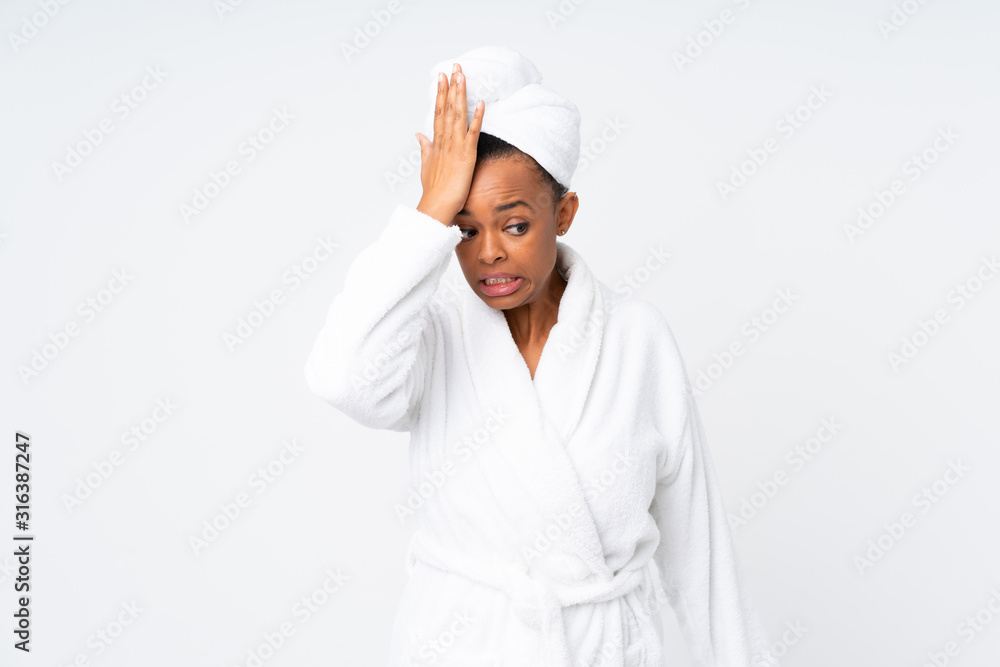 African american woman in a bathrobe over isolated background having doubts with confuse face expression African american woman in a bathrobe over isolated background having doubts with confuse face expression