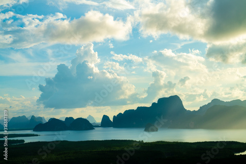 Morning sunrise on sea bay mangrove tropical rainforest colourful sky with cloud