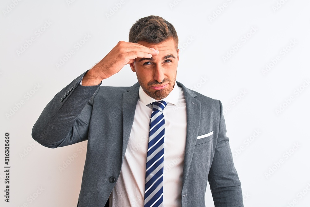 Young handsome business man wearing suit and tie over isolated background worried and stressed about a problem with hand on forehead, nervous and anxious for crisis Young handsome business man wearing suit and tie over isolated background worried and stressed about a problem with hand on forehead, nervous and anxious for crisis