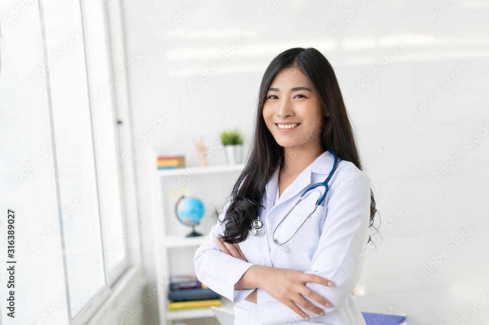 Doctor surgeon posing with arms crossed with stethoscope in an operating theatre,surgical room,success smart medical doctors,healthcare and medically Doctor surgeon posing with arms crossed with stethoscope in an operating theatre,surgical room,success smart medical doctors,healthcare and medically