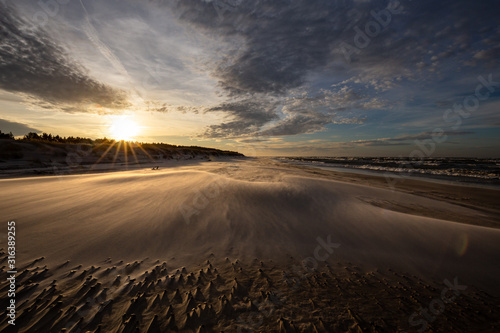 A beach after a storm during a windy evening in the Slowinski National Park. Czolpino, Leba, Poland.