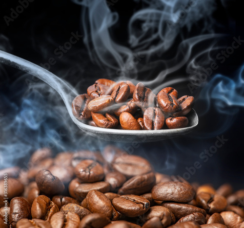 coffee beans in the detail close up © Vera Kuttelvaserova