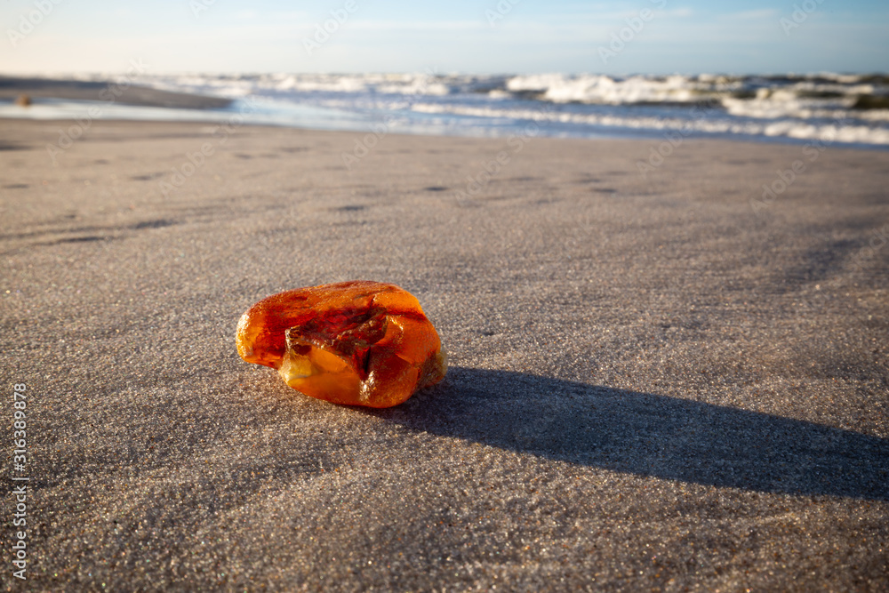 Amber on the beach in the Slowinski National Park. Czolpino, Leba, Poland.