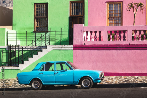 Old blue car in front of colorful houses, Bo-Kaap, Capetown © Daniel