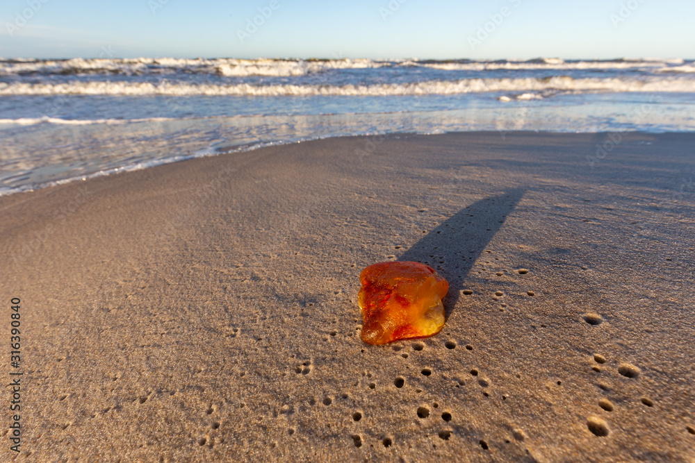 Amber on the beach in the Slowinski National Park. Czolpino, Leba, Poland.
